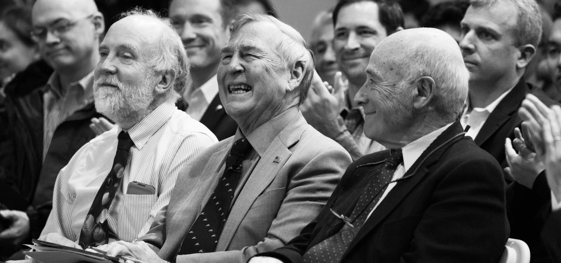 Three men laughing